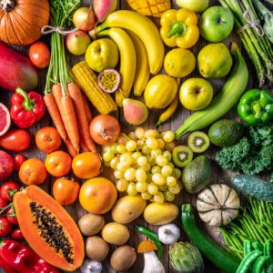 Colorful vegetables and fruits vegan food in rainbow colors arrangement full frame